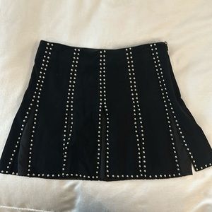 Lamarque black Suède mini skirt with silver studs and pleats.